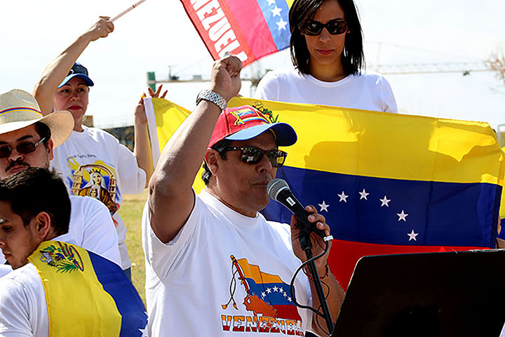 02222014 - Rigo Duran (cq), 59, of San Cristobal, Venezuela, yells "Viva Venezuela!" before initiating a moment of silence in remembrance of those who died in the Venezuelan protests. A rally was held at the Tempe Beach Park Saturday to raise awareness. Photo by Alec Damiano / JMC 351